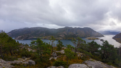 Scenic Fjord with Mountains and Cloudy Sky