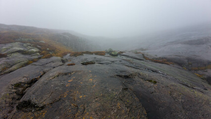Foggy Mountain Landscape with Rocky Terrain