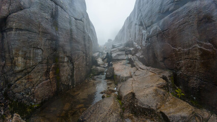Misty Rocky Canyon with Towering Cliffs