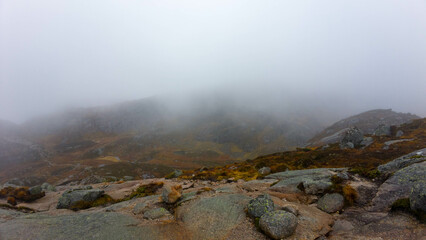 Foggy Mountain Landscape with Rocky Terrain