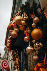 Outdoor Christmas decor with golden Christmas balls New Year winter composition
