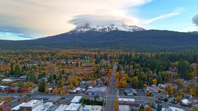 Time lapse over Mount Shasta, California, and Mout Shasta town. Lenticular clouds on the summit, autumn colors.