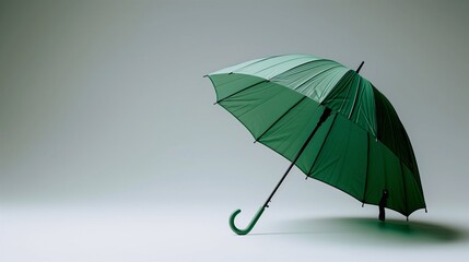 Green umbrella on gray background