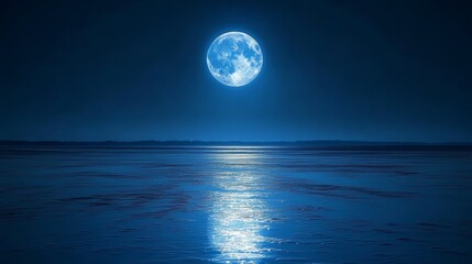 A full moon shines brightly over a calm, still body of water, reflecting its light in the ripples of the water.