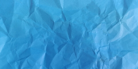 Crumpled blue paper background texture