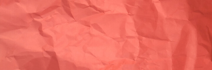 Crumpled pink paper background texture