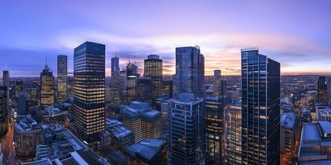 Obraz premium Modern City Skyline with CBD Office Buildings at Sunset, Drone View