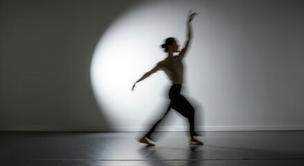 Contemporary dancer in silhouette spotlight