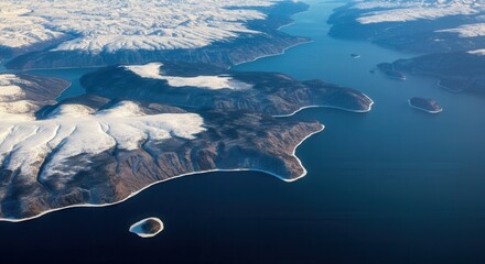 Aerial view of -capped coastline with blue waters