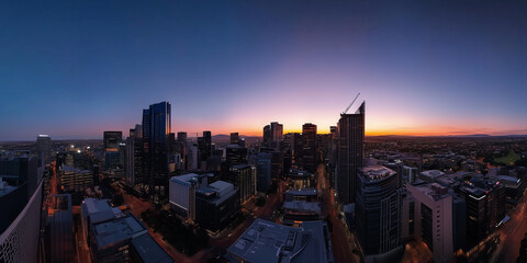 Obraz premium Modern City Skyline with CBD Office Buildings at Sunset, Drone View