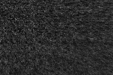 Black textured background, Smooth asphalt road. The texture of the tarmac, top view.