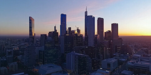 Fototapeta premium Modern City Skyline with Office Buildings and Drone View at Sunset