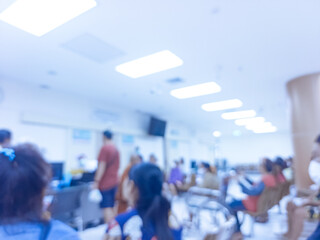 Background blurred hospital. Blurred hospital interior, patients talking to nurses. Patients waiting to see a doctor, information center, reception and patient care. people and maintenance. Medical 
