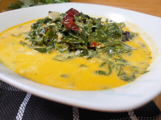 Indonesian traditional food 'Gulai Daun Singkong' or made from Tapioca or cassava leaves cooked...