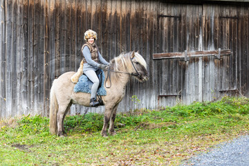 Icelandic horse riding. Rider has werewolf theme outfit