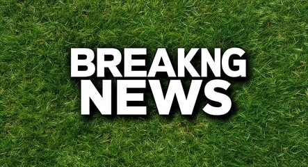 breaking news white lettering on grass background