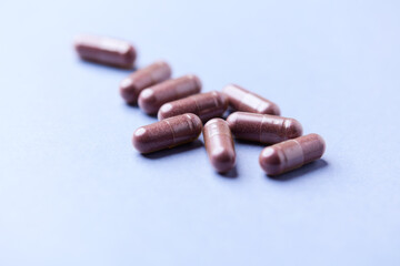 Lutein capsules. Dietary supplement on bright background. Soft focus. Close up. Copy space	