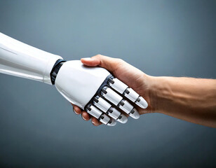 White robotic arm shaking hands with a human on a simple blue-gray background, symbolizing innovation.