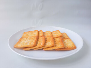 Sugar coated biscuits, also known as malkist, sweet and crispy. Served on white plate