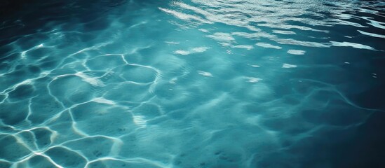 Obraz premium Tranquil Blue Water Surface with Gentle Ripples Under Soft Light Reflection