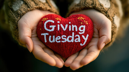 Hands holding red heart with "Giving Tuesday" sign, charity event, volunteer, kindness, help, symbol, activism, generosity, gift, donation