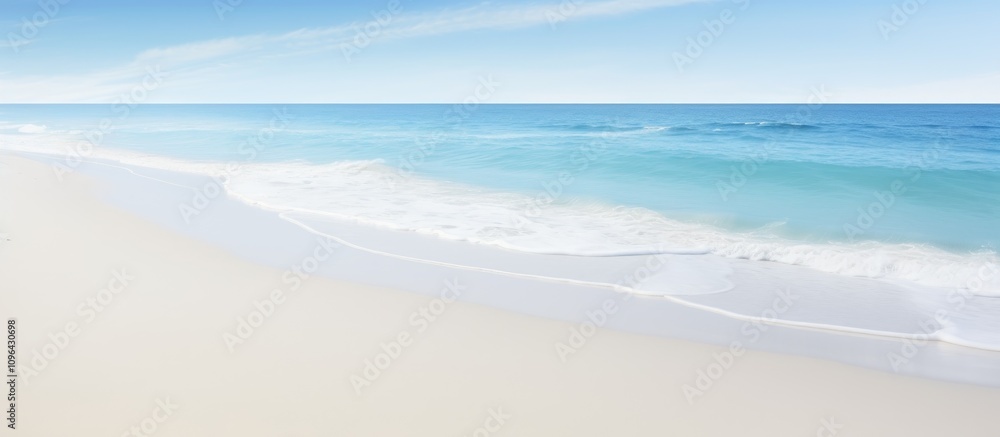 Aufkleber serene ocean waves gently lapping on a pristine white sandy beach under a clear blue sky creating a 