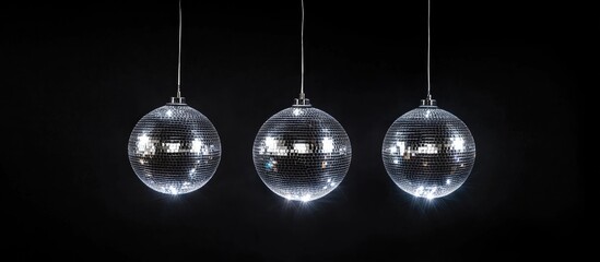 Three shimmering disco balls in a dark space reflecting light creating a vibrant retro party atmosphere for event advertising