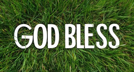 God bless you white lettering on grass background