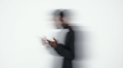 The effect of movement and blur of a person’s silhouette on a white background, conveying a feeling of emptiness and loneliness