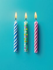 Three birthday candles lit