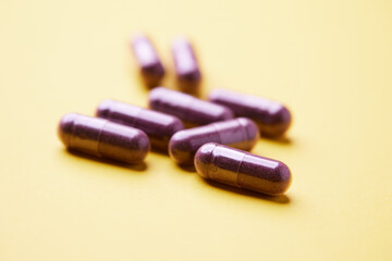 Lutein capsules. Dietary supplement on bright background. Soft focus. Close up. Copy space	