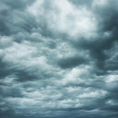 Obraz premium A dramatic sky with sun rays piercing through gaps in massive white clouds