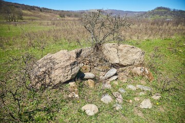 The remains of an ancient stone structure dolmen. Archaeology, 2-3 millennia BC