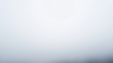 Soft, blurred white background with subtle gradient.
