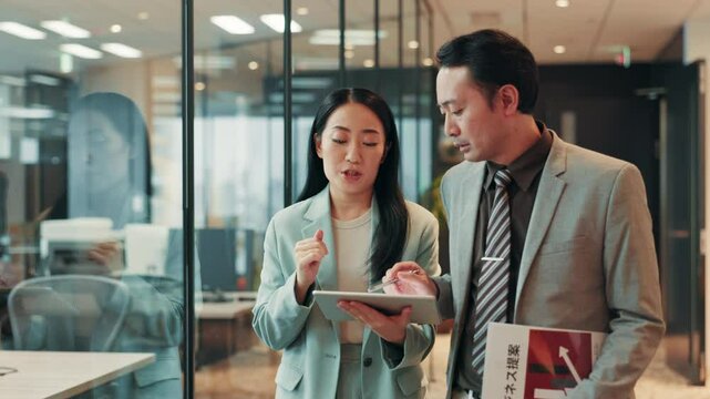 Tablet, planning and business people in office, conversation and online report for project. Employees, consulting and coworkers with tech, app or internet with communication, company website or Japan