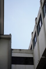 Dark gray building with blue sky without clouds
