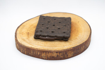 Chocolate biscuits on wood chips