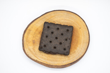 Chocolate biscuits on wood chips