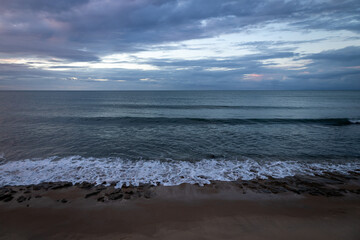 Sea edge at blue hour. Calm and peaceful sea before dusk.