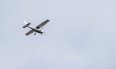 
a small passenger plane in flight in the sky