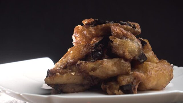 Fried eggplants with meat on a wooden background. Food concept. Chinese food.