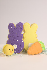 Easter sugar cookies and macarons .