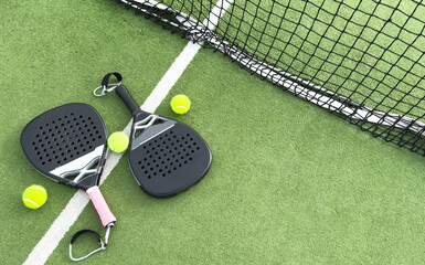 paddle tennis racket and balls on court 