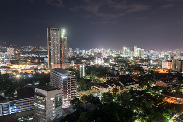 Obraz premium Night Cebu Cityscape with Buildings Lights in Background. Philippines.