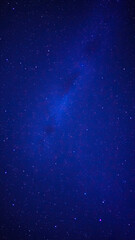 Fototapeta premium The dark canvas of the night sky filled with an infinite number of twinkling stars that form a dazzling display of light and color, astronomical, space, celestial, cosmic, nocturnal