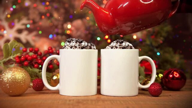 Two white blank Christmas cup drinks are on a table at home with blinking Christmas lights for a video mockup graphic design template.
