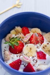Natural yogurt with strawberries, banana, cereals and seeds. Healthy food. Healthy breakfast.