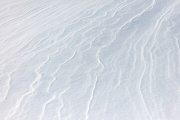 The snow is white and the ground is covered in it