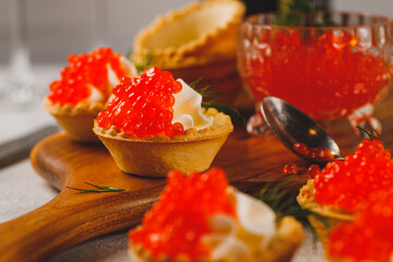 Tartlets with red caviar and cottage cheese