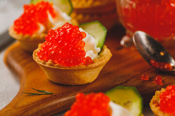Tartlets with red caviar and cottage cheese